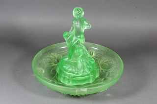 A 1930's green pressed glass bowl, the centre decorated a  standing figure of "Peter Pan" 12"