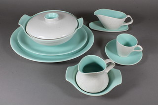 A 44 piece Poole Pottery grey and turquoise dinner service comprising 2 oval meat plates 14" and 12", twin handled circular  tureen and cover 8" and 9", sauce boat and stand, boat shaped  dish 13", 6 dinner plates 10", 5 side plates 9", 6 tea plates 7" - 1  chipped, 6 bowls 6" - 1 chipped, jug 3.5" - chipped, a  rectangular butter dish and stand 5.5", 6 cups and 6 saucers