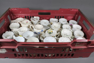 A collection of 61 various pottery shaving mugs