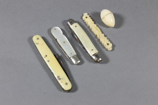 A folding fruit knife with silver blade and mother of pearl grips, 2 pocket knives etc