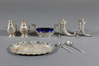 An oval white metal dish 5", a white metal salt and pepper pot  in the form of horns, do. salt in the form of a long boat, 2  pepperettes and 2 condiment spoons