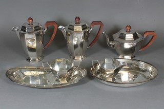 An Art Deco Walker & Hall 5 piece octagonal shaped silver  plated tea service comprising teapot, 2 hotwater jugs, cream jug,  sugar bowl, an oval silver plated twin handled dish and an entree  dish base