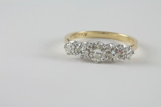 An 18ct yellow gold engagement/dress ring set 5 diamonds,  approx 1.30ct