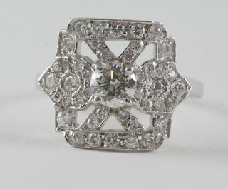 An 18ct white gold Art Deco style dress ring with saltire and set diamond to the centre