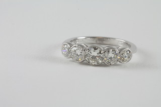 An 18ct white gold dress ring set 5 brilliant cut diamonds, approx  1.50ct