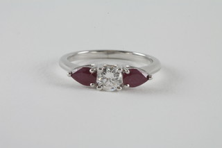 An 18ct white gold pear shaped dress ring set rubies and  diamonds, rubies approx 0.79ct, diamonds approx 0.49ct