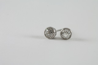 A pair of diamond ear studs set old cut diamonds in an 18ct gold mount, approx 0.7ct
