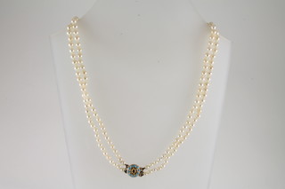 A double rope of pearls with "gold" clasp set turquoise