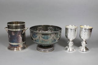 A circular embossed silver plated bowl with swag decoration by Elkingtons 8.5", a silver plated soda siphon holder 6.5" and a  pair of planished goblets