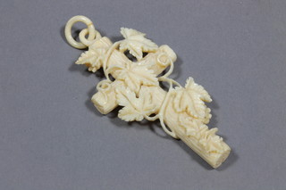 A carved ivory cross with leaf decoration