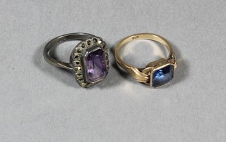 A 9ct gold dress ring set a blue stone and a silver dress ring set an amethyst coloured stone