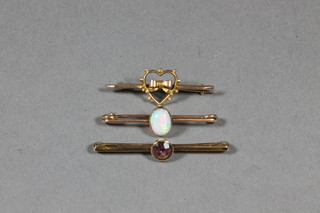 A gold bar brooch set a cabouchon cut opal and 2 other bar  brooches