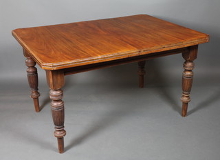 A late Victorian mahogany extending dining table raised on ring  turned, tapered and reeded legs 55"l x 42"w x 30.5"h