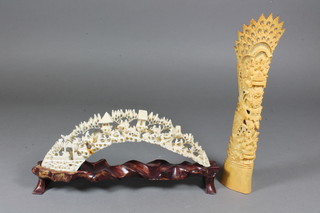 A carved pierced ivory figure group 9" and a pierced and carved section of bone 9.5"