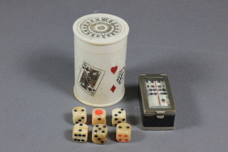 A set of miniature carved bone dominoes, a carved bone dice  shaker and 6 dice