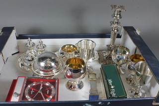 A silver plated 3 piece condiment set and stand and other plated  items