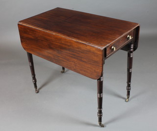 A Regency mahogany Pembroke table fitted end drawer with  faux fronted opposing drawer, raised on ring turned tapered legs,  brass caps and casters, 29"h x 39"w x 34.5"d