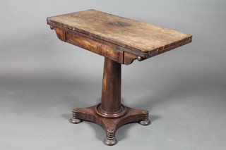A William IV mahogany card table, the hinged top enclosing a  baize lined interior, raised on a tapered column support,  quadripartite base with flattened bun feet 29.5"h x 36"w x 18"d