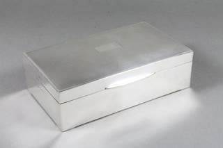 A rectangular silver cigarette box with engine turned decoration,  Birmingham 1941 6"