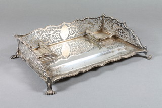 An Edwardian rectangular silver standish with with pierced three-quarter gallery, 2 ink well recepticals and pen recess, raised  on panel feet, London 1902, makers mark Charles Stuart Harris,  15 ozs