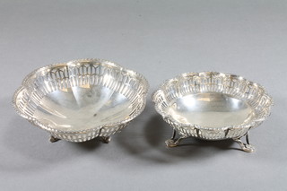 A pierced circular silver dish raised on 3 hoof feet Birmingham 1928 and 1 other silver dish, marks rubbed, 3 ozs