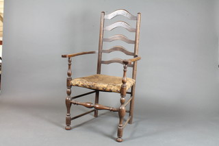 A late 19th Century oak ladder back elbow chair, having foliate  tapestry woven upholstered seat, raised on turned underframe