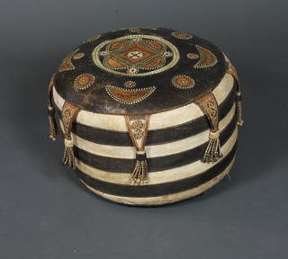 An interesting North African leather ottoman of circular form  having geometric decoration 13"h x 19"diam. together with a  camel stool