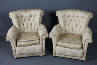 A pair of early 20th Century tub arm chairs, having foliate  tapestry woven buttoned upholstery, raised on casters