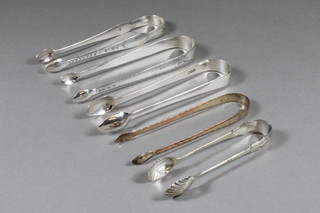3 Georgian silver bright cut sugar tongs, 3 ozs, together with 2  silver plated sugar tongs
