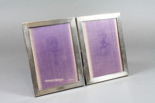 A pair of 2 rectangular silver easel photograph frames,  Birmingham 1931, 6" x 4.5"