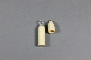 A glass scent bottle contained in a bone case 2.5"