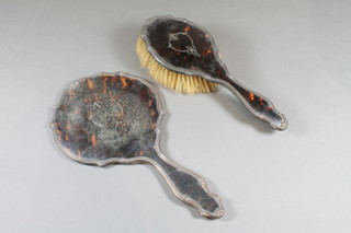 A silver and tortoiseshell backed hand mirror and hair brush,  Birmingham 1921