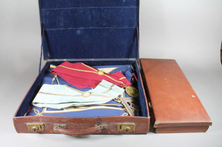 Masonic regalia comprising a Mark Master Masons WM apron, a Royal Ark Mariners Commanders apron, a London Grand Rank  apron and collar, a silver plated Past Zeds collar jewel and collar,  a past Master's apron, collar and collar jewel, 2 attache cases and  a Master Masons apron