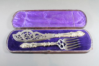 A pair of Victorian pierced silver plated fish servers, cased