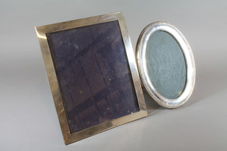 A rectangular silver easel photograph frame Birmingham 1913 7"  x 8.5" and an oval photograph frame Birmingham 1920 9.5" oval
