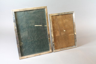 A plain silver easel photograph frame, Birmingham 1923 12" x 8.5" and 1 other Birmingham 1925 10" x 7.5"