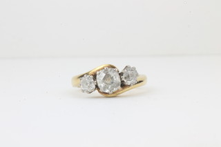 An 18ct gold engagement/dress ring set 3 diamonds