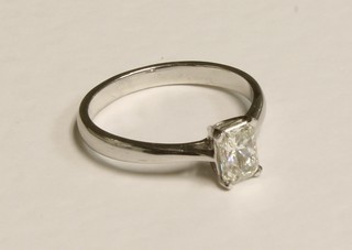 A lady's 18ct white gold dress ring set a princess cut solitaire diamond