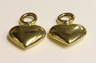 A pair of 18ct gold heart shaped pendants, 9.4 grams