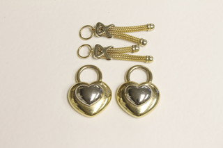 A pair of gilt metal heart shaped pendants together with a pair of gilt metal earrings