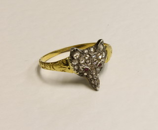 An 18ct gold dress ring in the form of a fox mask set diamonds