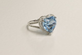A 14ct white gold dress ring set a heart shaped topaz, approx 6.75ct