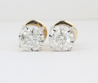 A pair of 18ct white and yellow gold diamond set stud earrings  with screw backs, approx 1.38ct