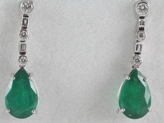 A pair of 18ct white gold emerald and diamond set drop earrings