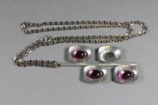 A Georg Jensen pewter pendant set cabouchon cut amethyst  coloured stones - 1 missing, the reverse marked Pewter Georg  Jensen 220E