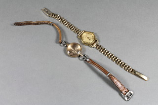 A ladies Rolex wristwatch contained in a 9ct gold case, an Avia wristwatch in a 9ct gold case with integral bracelet and a Rotary  wristwatch in a gold case