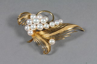 A gilt metal spray brooch set pearls
