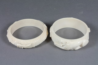 2 carved ivory bangles