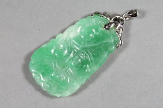 A jade pendant with 22ct gold mount