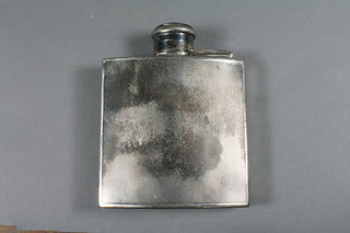 An Art Deco silver hip flask with engine turned decoration,  London 1930 by The Goldsmiths & Silversmiths co. 4 ozs